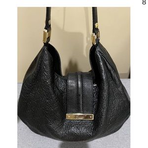 Authentic Gucci shoulder monogram hobo bag in black .
